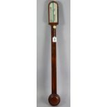 An early 19th century stick barometer in rosewood case with arched top, the silvered dial