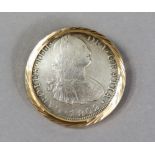 An 1802 Carlos IV silver eight reales coin, Potosi mint, in 18k brooch mount.