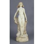 R. SCHEGGI; a sculptured white alabaster figure of a young female nude standing against rocks, signe