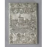 A Victorian silver ‘castle-top’ card case with hinged lid & embossed landscape decoration with