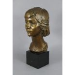 DAVID BACKHOUSE (b. 1941) A bronze bust of a young girl, on black marble plinth, 18½” high over-all,