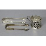 A Victorian silver octagonal straight-sided mustard pot with hinged cover & pierced scroll sides,