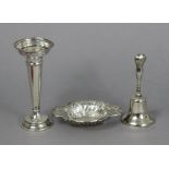 An Edwardian silver table bell with loaded handle, 5” high, Birmingham 1905, by Sydney & Co.; a