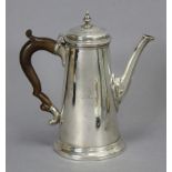 A GEORGE II SILVER COFFEE POT of plain tapered form, with slightly curved eight-sided spout, domed