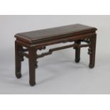 A painted Chinese hardwood bench with hard seat & square legs joined by shaped stretchers, 39 ¼”