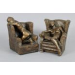 DAVID BACKHOUSE (b. 1941) A pair of bronze female nude figures, each seated in an armchair, one