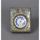 A pocket watch with white & blue enamelled dial in an embossed silver-mounted easel case with
