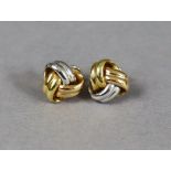 A pair of 18ct yellow & white gold knot design earrings (6.8g).