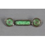 A pair of Chinese carved green jade & silver-mounted circular ear-clips; & a Chinese carved &