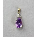 An amethyst pear-shaped pendant in 9ct gold mount with trio of small white sapphires.