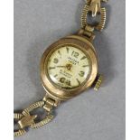 An Oriosa ladies’ wristwatch, the oval silvered dial with gold baton numerals & Arabic quarters,