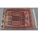 An Afghan rug of madder ground with geometric designs & narrow border, 34” wide x 52” long.