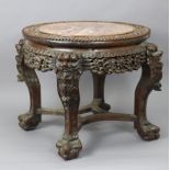A Chinese hardwood circular jardiniere stand inset rouge marble top, with all-over carved &