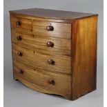 A Victorian mahogany bow-front chest with moulded edge to the plain rectangular top, fitted two