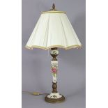 A porcelain & gilt-metal table lamp on slender tapering column & round pedestal foot, painted