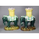 A pair of late 19th century continental majolica-glazed pottery Elephant & Castle spill vases,