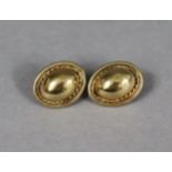 A pair of 9ct gold boss-design/ovolo-shaped earrings with rope-twist borders (3.2g).