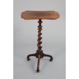 An early 19th century rosewood flower table with later shaped rectangular top on barley-twist &