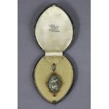 A 19th century Italian micro-mosaic oval pendant depicting two birds amongst flowers, in gold mount,