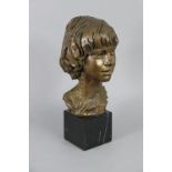 DAVID BACKHOUSE (b. 1941) A bronze bust of a young boy, on black marble plinth, 16¼” high over-