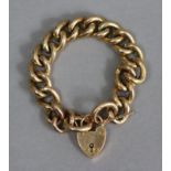 A 9ct gold bracelet of hollow curb links, with padlock clasp & safety chain (33g).