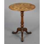 A Victorian walnut tripod table with circular inlaid chess-board top & marquetry decoration, on