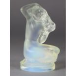 A Lalique frosted & opalescent glass figure of a crouching female nude titled “Floreal”, on a