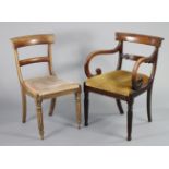 A regency grained mahogany elbow chair with curved & open splat back, scrolling open arms, padded