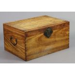 A Chinese camphor wood trunk with hinged lift lid & brass side handles, 32” wide x 17¼” high x