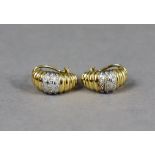 A pair of 18ct yellow & white gold ribbed earrings set numerous small diamonds (11g).