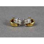 A pair of 18ct gold earrings of loop design, each set with numerous small diamonds (7.1g).