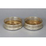 A pair of modern silver wine coasters, each with pierced sides & inset turned wood base, 5” dia.,