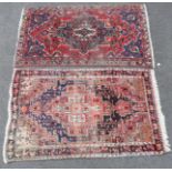 A Persian city rug of madder ground featuring a central medallion surrounded by geometric floral