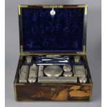 A WILLIAM IV COROMANDEL & BRASS-MOUNTED TRAVELLING TOILET CASE bearing the printed trade label of “