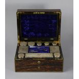 A LATE VICTORIAN COROMANDEL & BRASS-INLAID TRAVELLING TOILET CASE, fitted ten cut glass