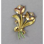 A two-colour yellow & rose metal brooch in the form of two tulips set numerous square-cut rubies,