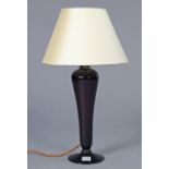 A 20th century Amethyst glass table lamp on fluted tapering slender column & circular pedestal foot;