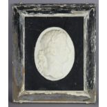 A sculptured marble oval relief depicting the bust in profile of the Roman emperor Tiberius,