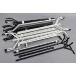 Four white-finish tubular-metal clothes rails; & three black-finish ditto.