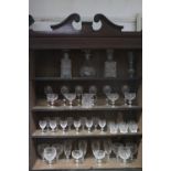 A pair of glass square decanters with mushroom stoppers, 9¾” high; & various cut-glass drinking