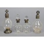 Two glass communion bottles with silver mounts & cruciform finials, one with hallmarks for London