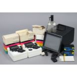 A vintage polaroid land player; various ditto cartridges; & various other camera accessories.