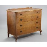 A mahogany-finish serpentine-front chest fitted four long graduated drawers with brass swing