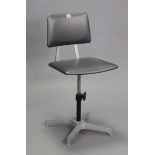 A Du-al silvered-metal swivel office chair with a black vinyl padded seat & back.
