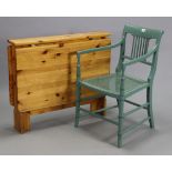 A green painted spindle-back elbow chair with a woven-cane seat, & on faux-bamboo legs with