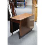 A late 19th century mahogany drop-leaf dining table with moulded edge & rounded corners to the