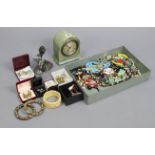A mantel timepiece in simulated snakeskin case, 6” high; together with various items of costume