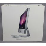 An Apple “Imac” computer, boxed.