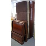 A mahogany-finish single sleigh bed, with a slide-away mattress below, 33¾” x 85”.