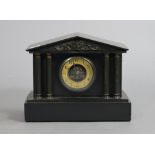 A late 19th/early 20th century mantel clock with two-part dial, & in a black slate architectural-